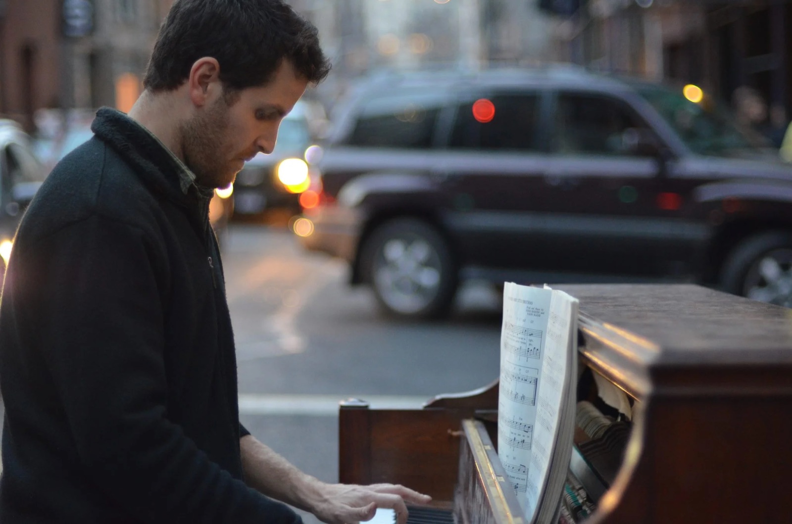 Playing the street piano at dusk in New York City