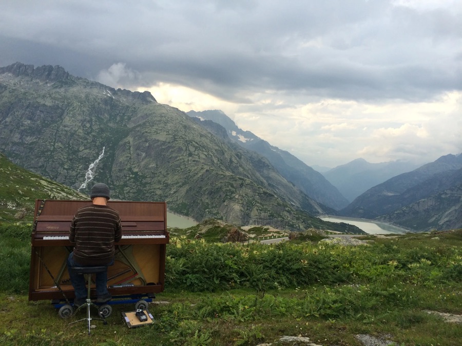 Playing the piano on a mountain pass in the Swiss Alps